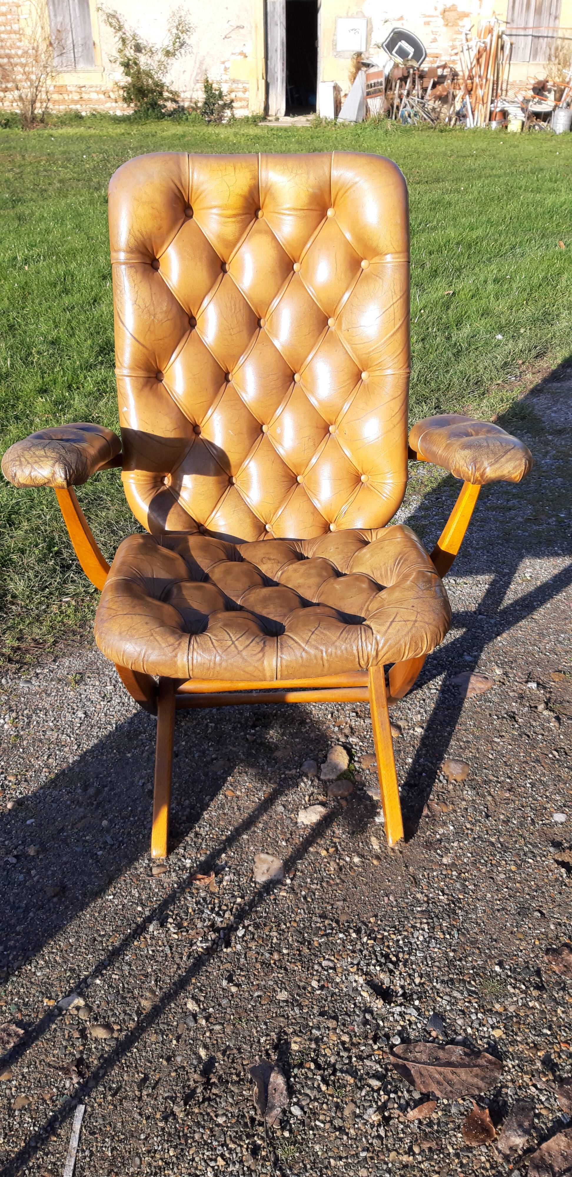 Pair of chesterfield style leather armchairs