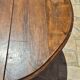 Round dining table with a drop-leaf top in solid walnut, late 19th century.