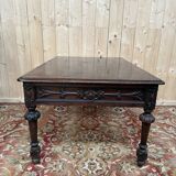 Middle table in a sculpted Louis XIII style living room.