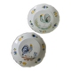 Pair of plates with naive Eastern rooster decoration