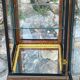 Pair of display cases in magnifying glass and black & gold lacquer, 20th century period