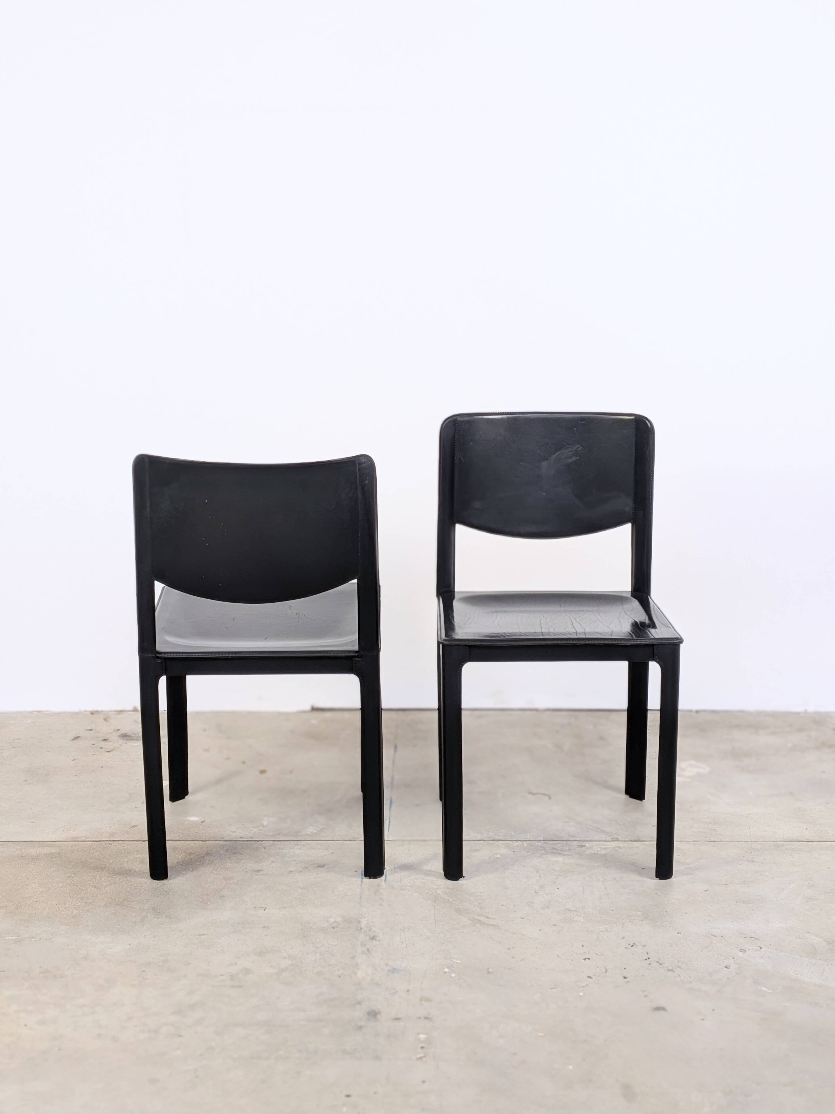 Pair of Matteo Grassi chairs in black saddle leather, 1980s.