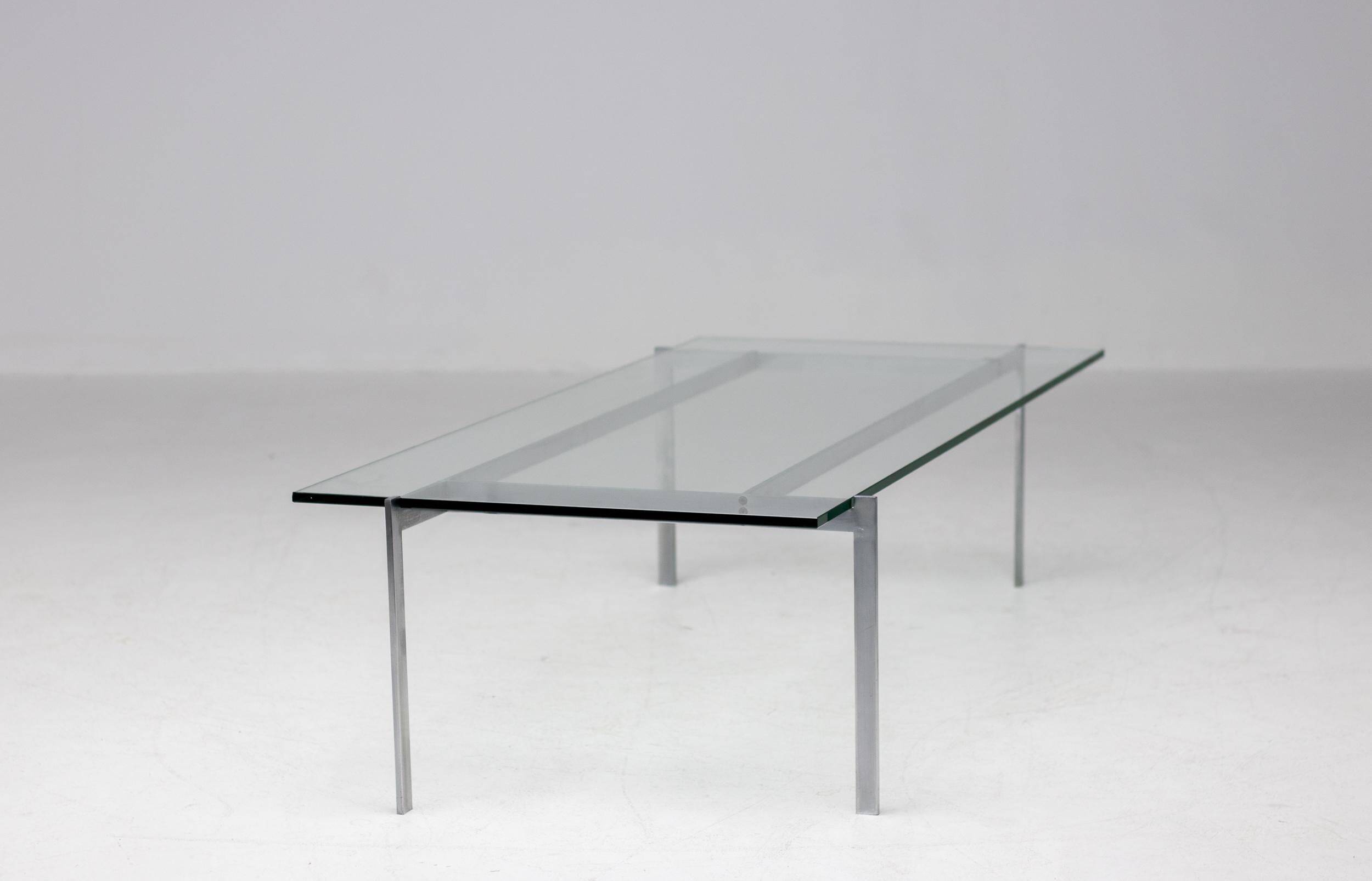 Architectural rectangular coffee table in steel and glass.