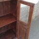 Small glass cabinet in old wood