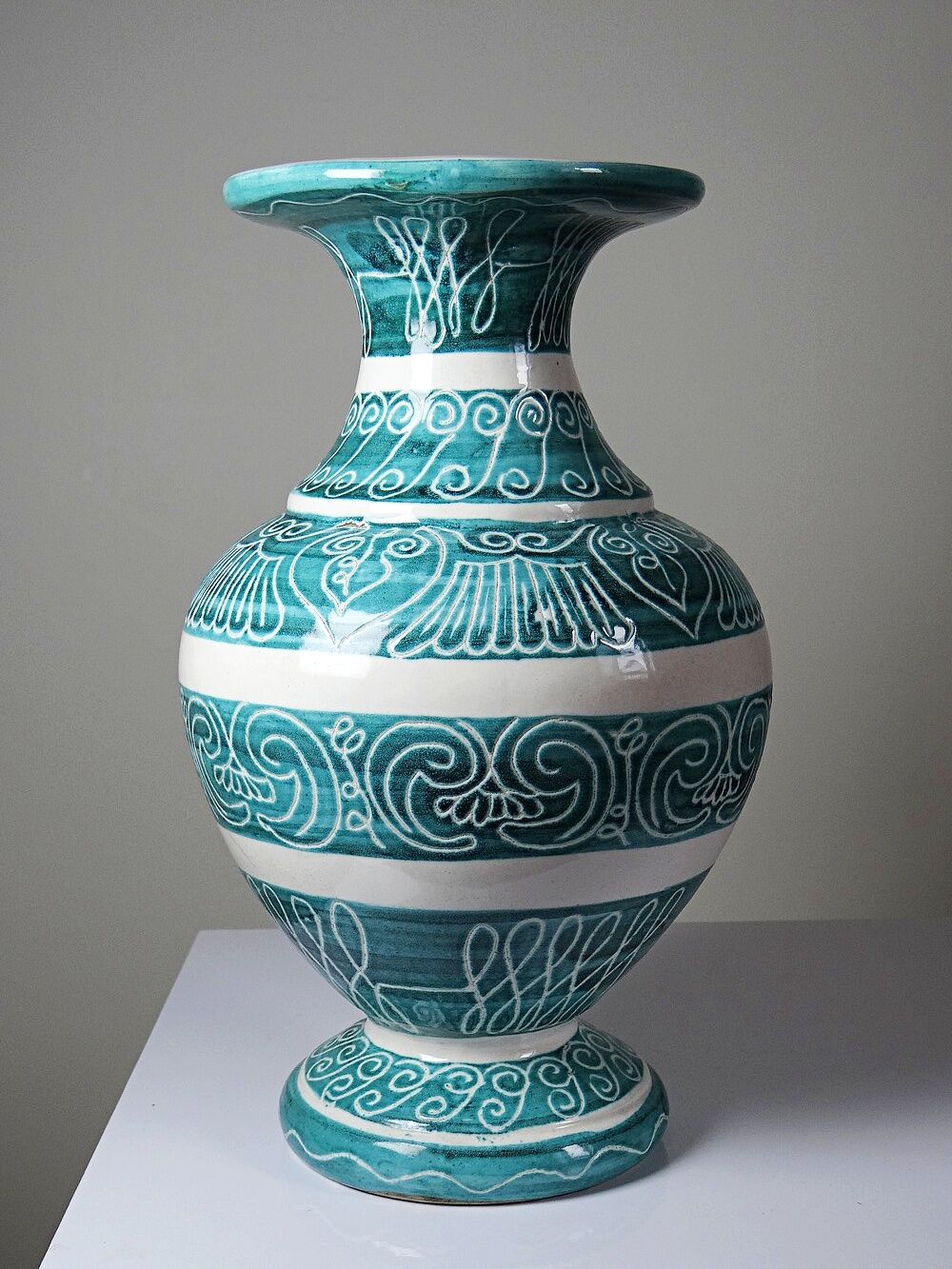 Vintage turquoise ceramic baluster vase with incised decoration.