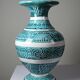 Vintage turquoise ceramic baluster vase with incised decoration.