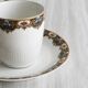 7 Limoges porcelain cups and saucers with gold decoration and floral motif.