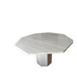 Octagonal dining table in travertine