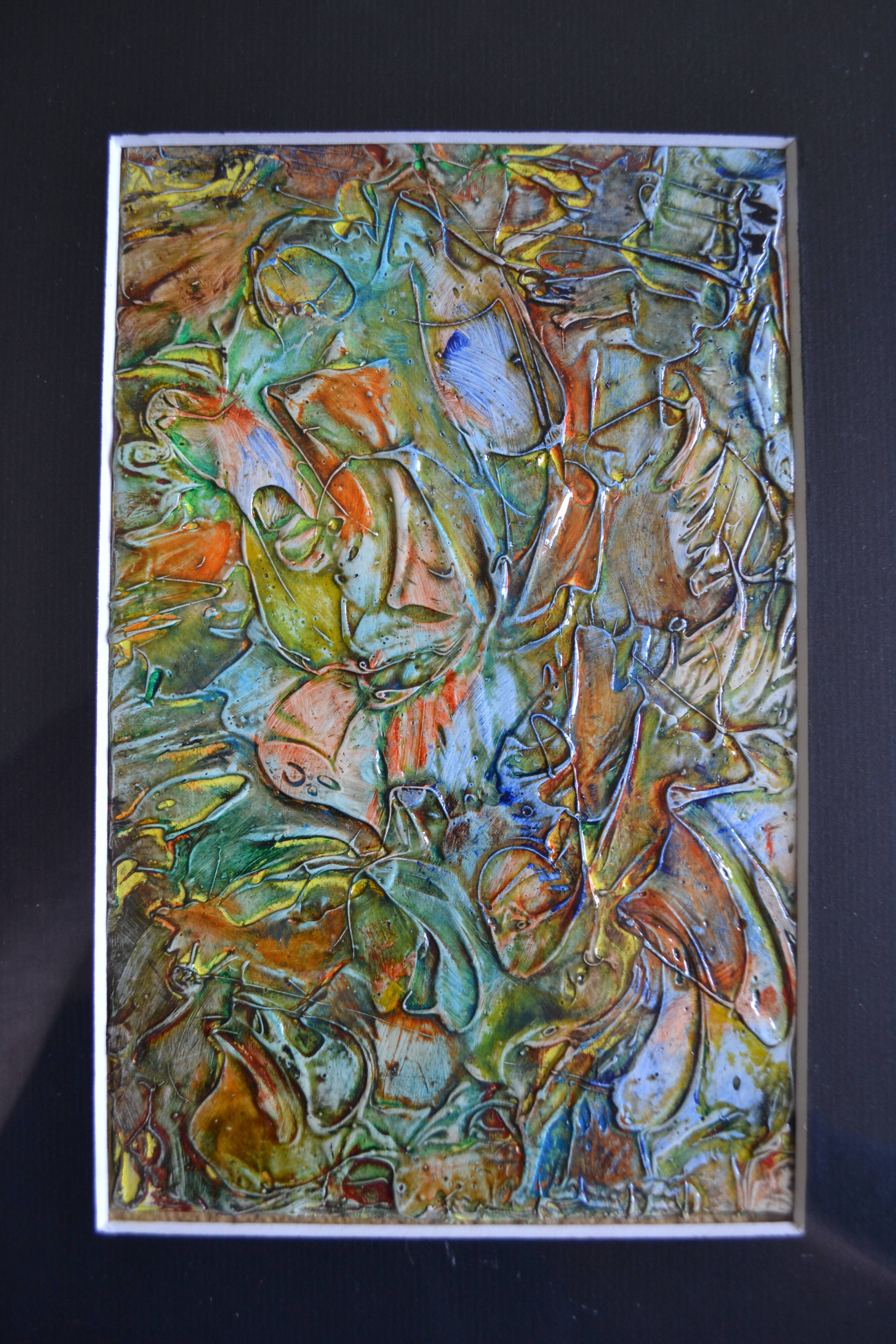 Framed abstract painting under glass