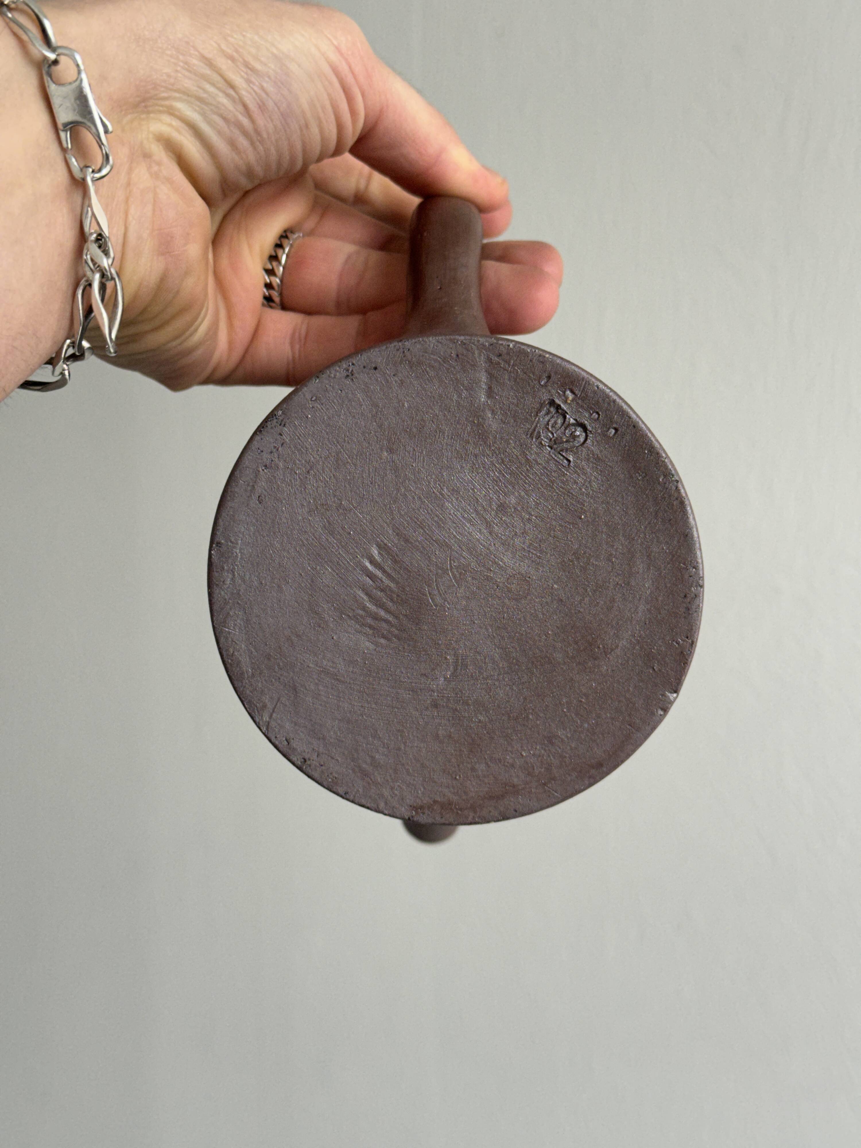 Small pitcher in brown glazed stoneware