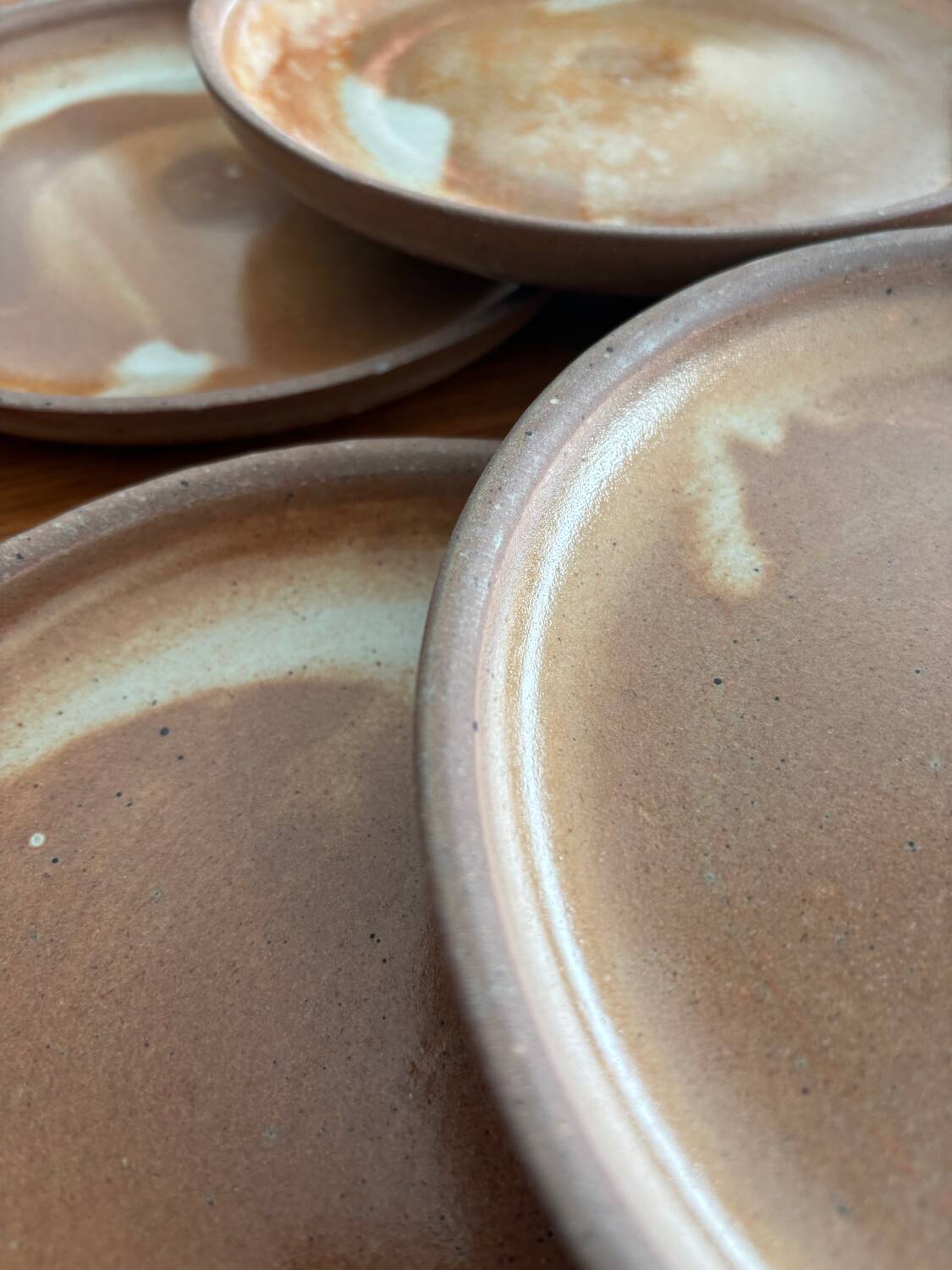 Lot of vintage 1970s beige stoneware dessert plates, handmade.