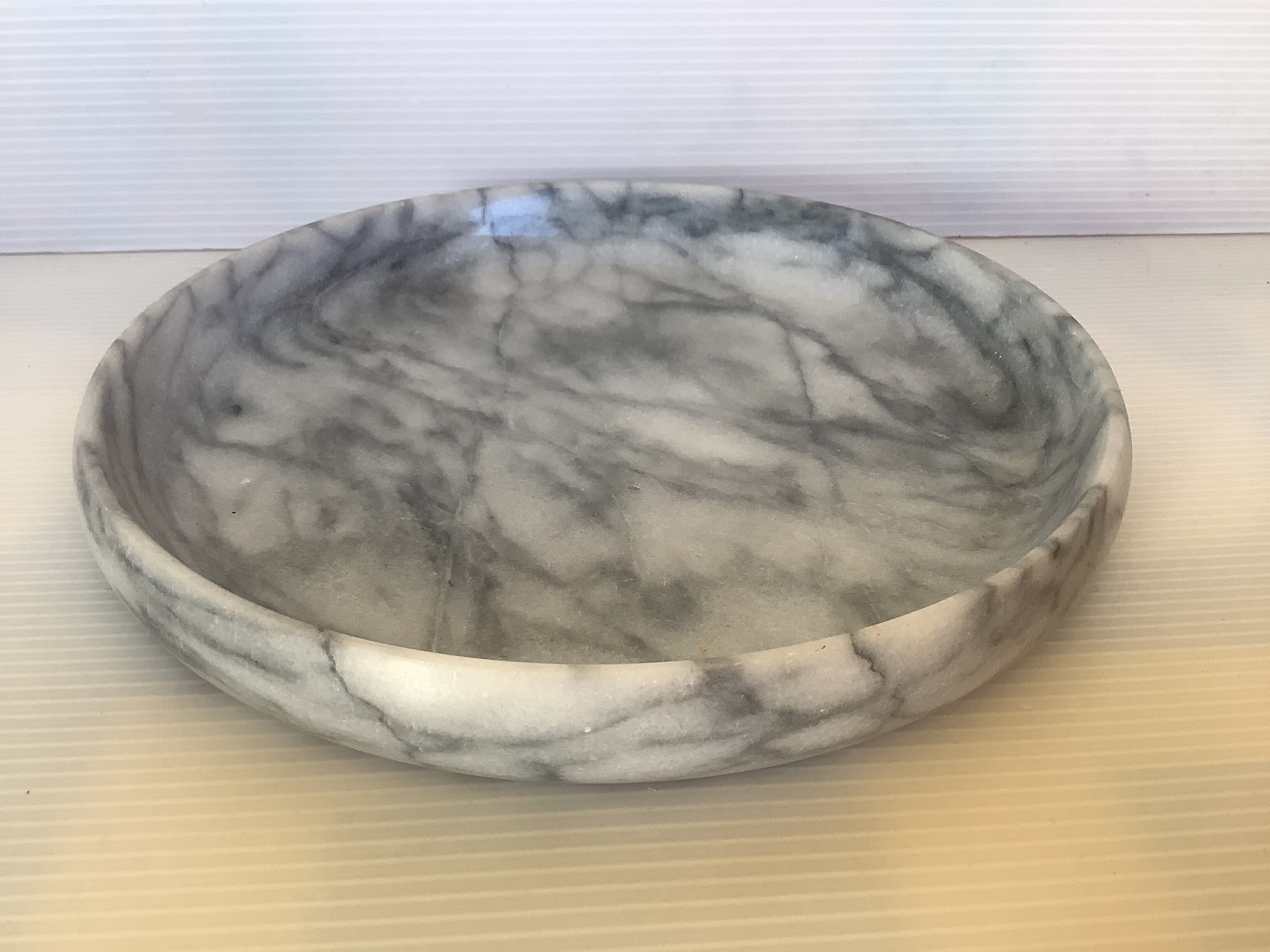 Empty round pocket in gray marble