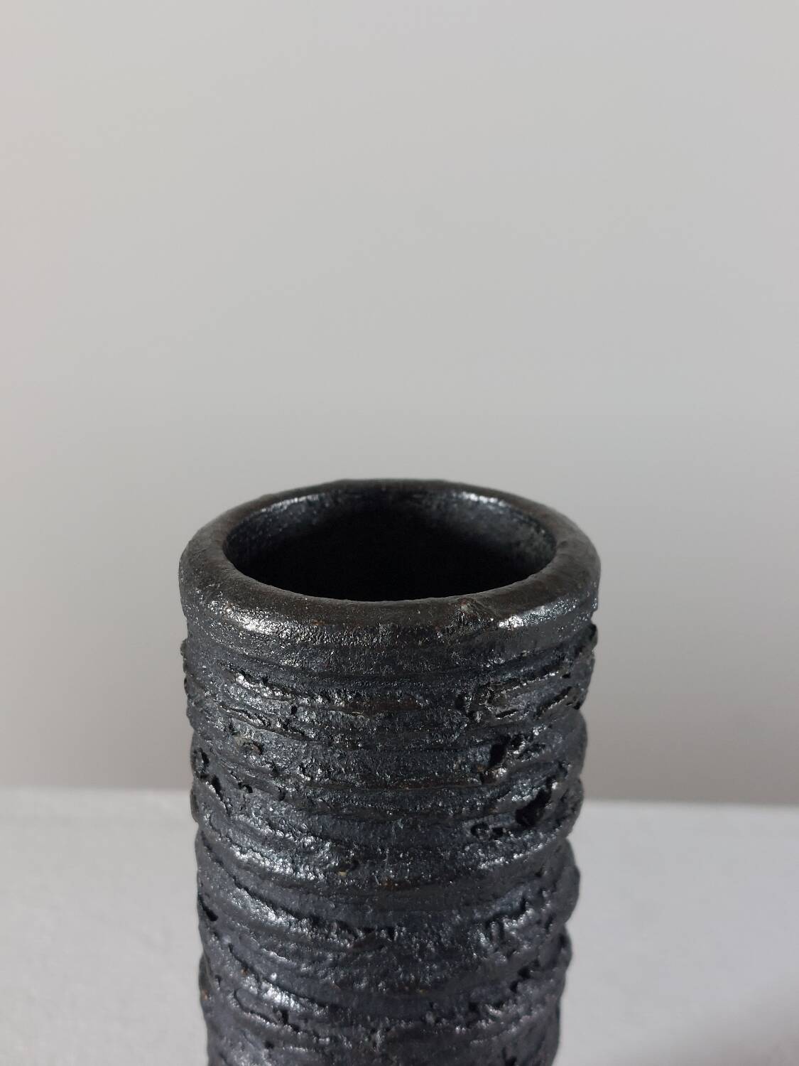 Small vintage brutalist vase with oxidised glaze from the 1950s.