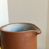 Pitcher in brown sandstone