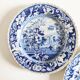 Five 19th century Calais earthenware plates with a romantic gallant couple decor