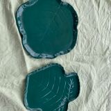 Two dishes empty pocket slurry, biscuits in the shape of vintage green leaf