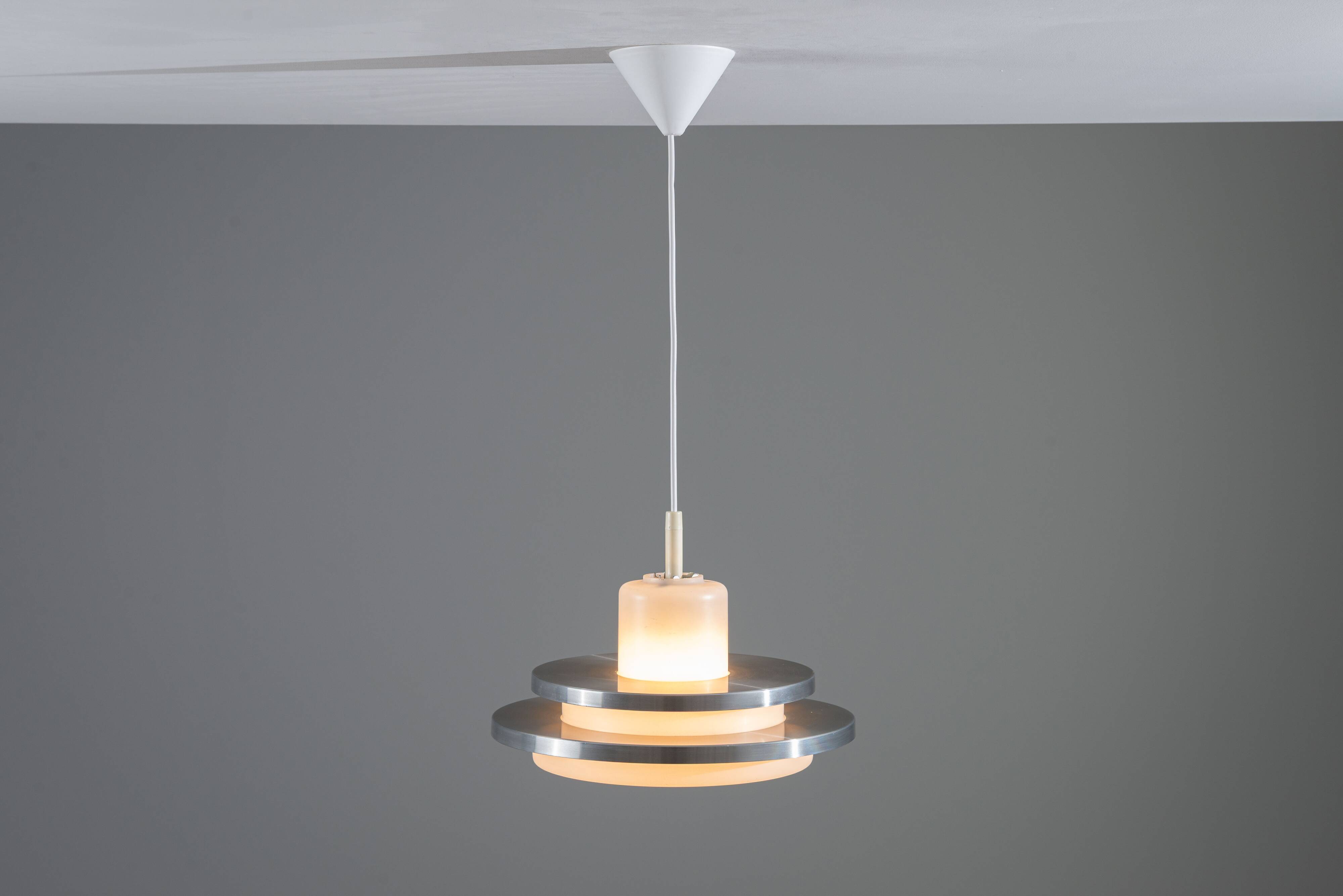 Doria pendant in opal glass with decorative aluminium discs