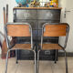 Pair of vintage adult school chairs in patinated metal