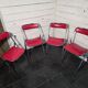 4 vintage folding chairs in red faux leather Plichaise, 1970s