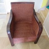 Vintage colonial-style armchair in woven rattan and exotic wood