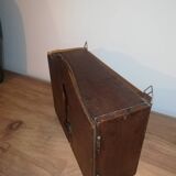 Old wooden key box cut out in the shape of a lock