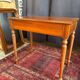 Small solid wood desk with a drawer.
