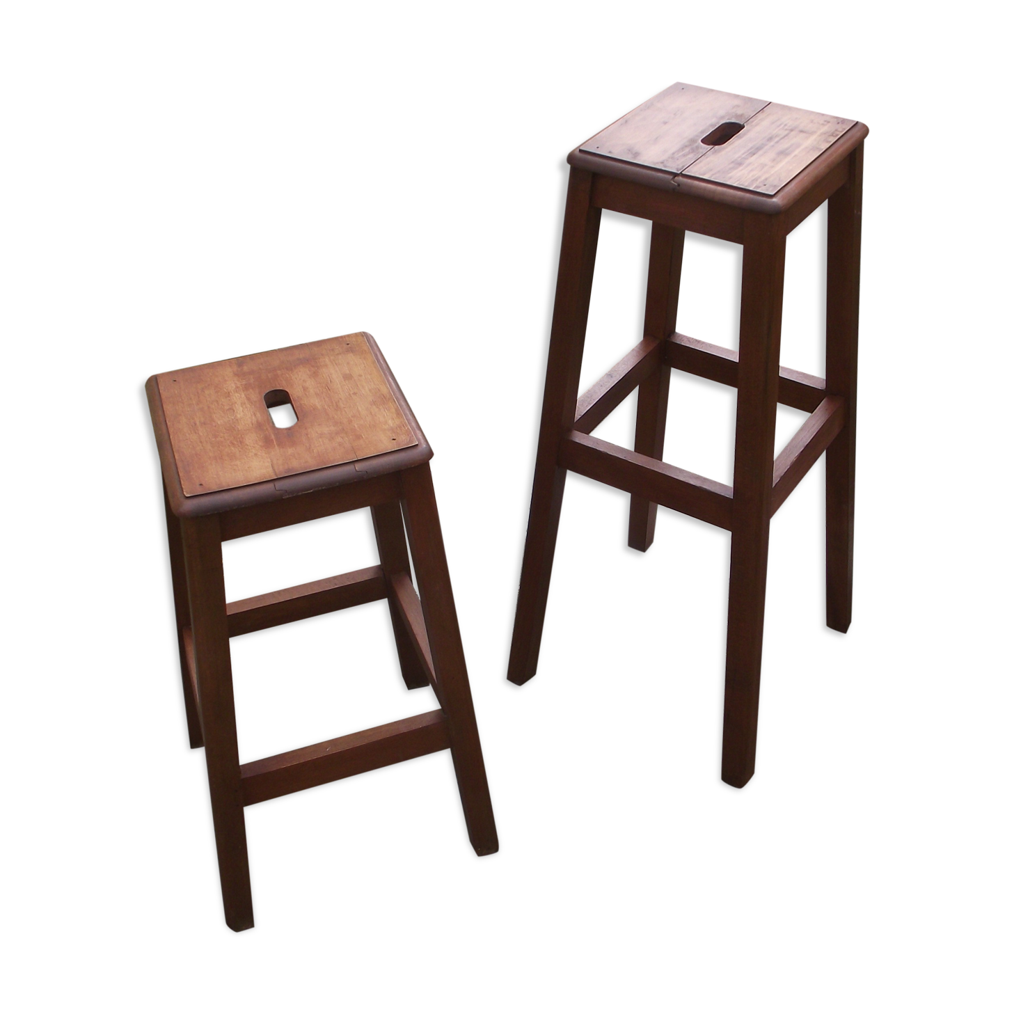 Two wooden artist stools in the early 20th century