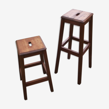 Two wooden artist stools in the early 20th century