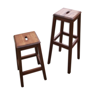 Two wooden artist stools in the early 20th century