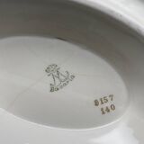 Porcelain sauce boat with black and gold checkered border