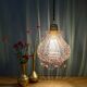 Suspension globe vintage en verre granité rose