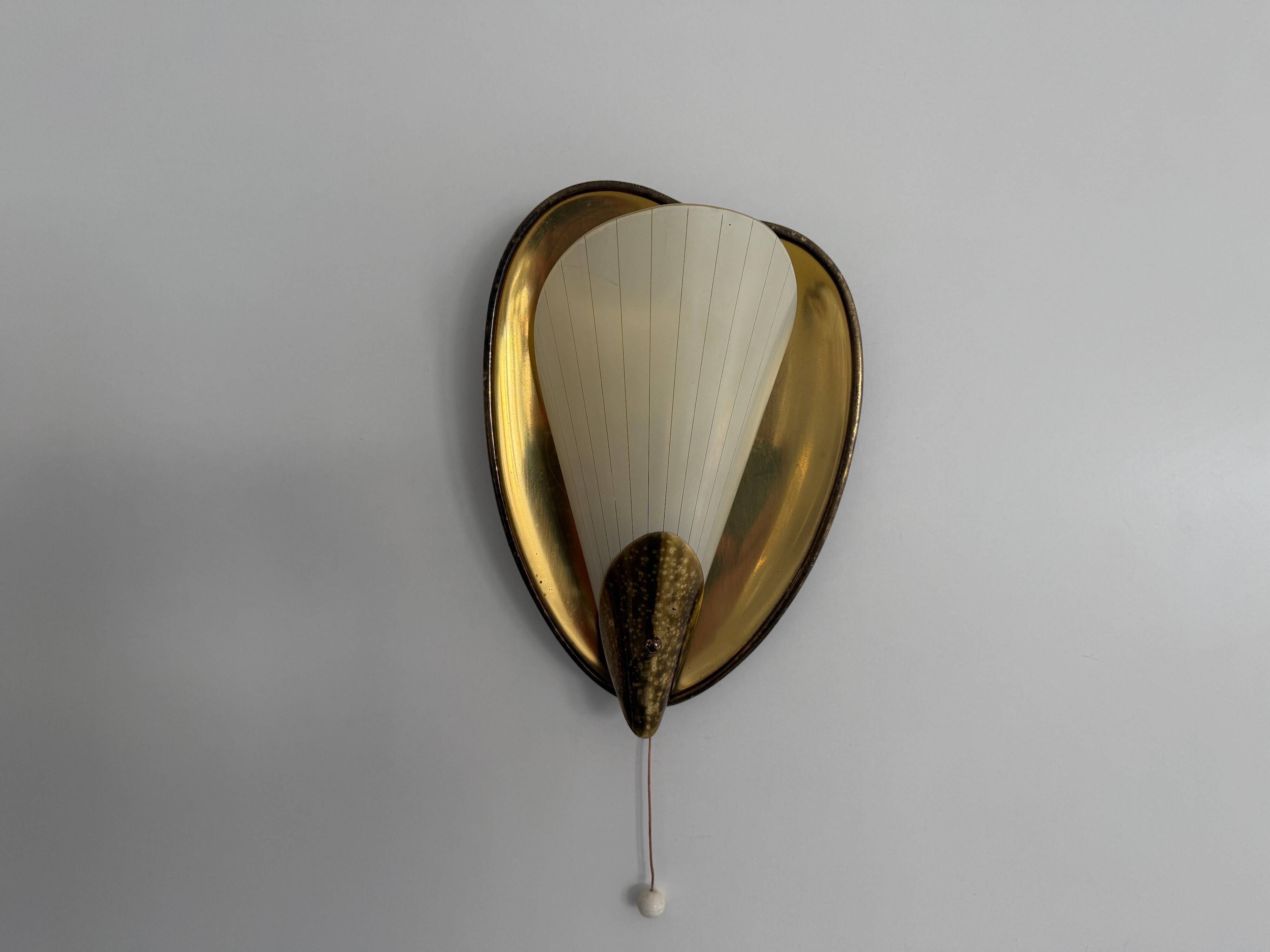 Pair of brass and glass wall lights from the mid-century, 1950s, Germany.