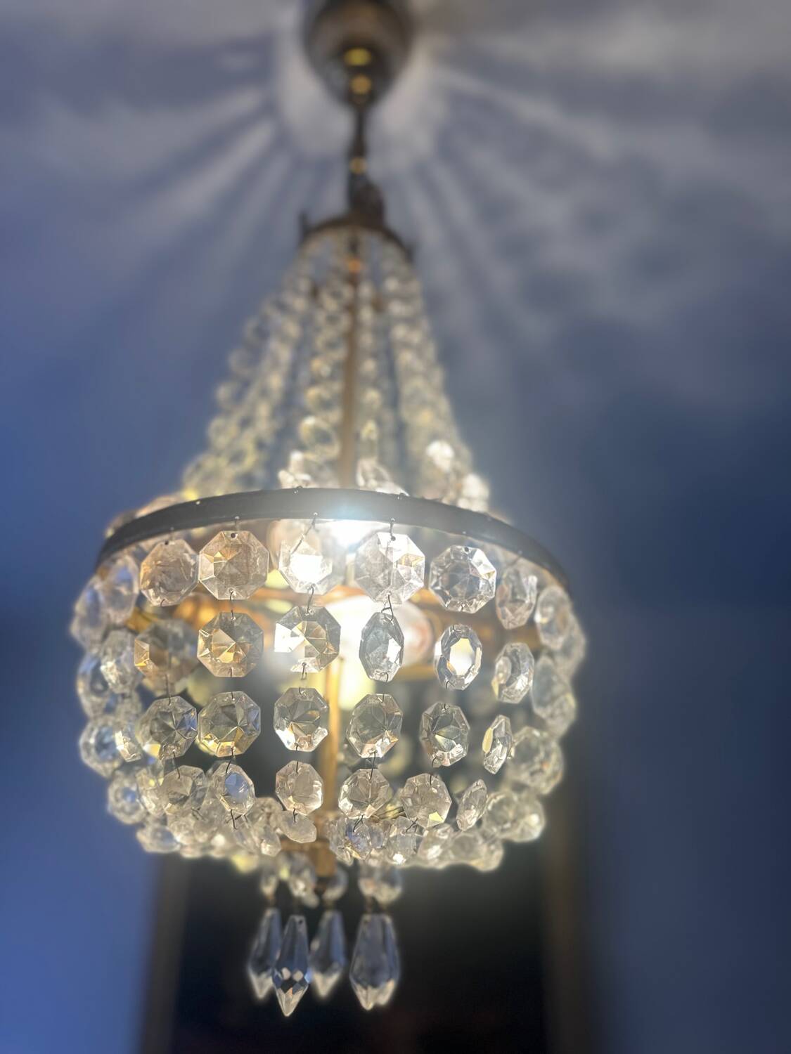 Basket chandelier with crystal and gilded brass pendants, circa 1930.
