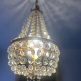 Basket chandelier with crystal and gilded brass pendants, circa 1930.