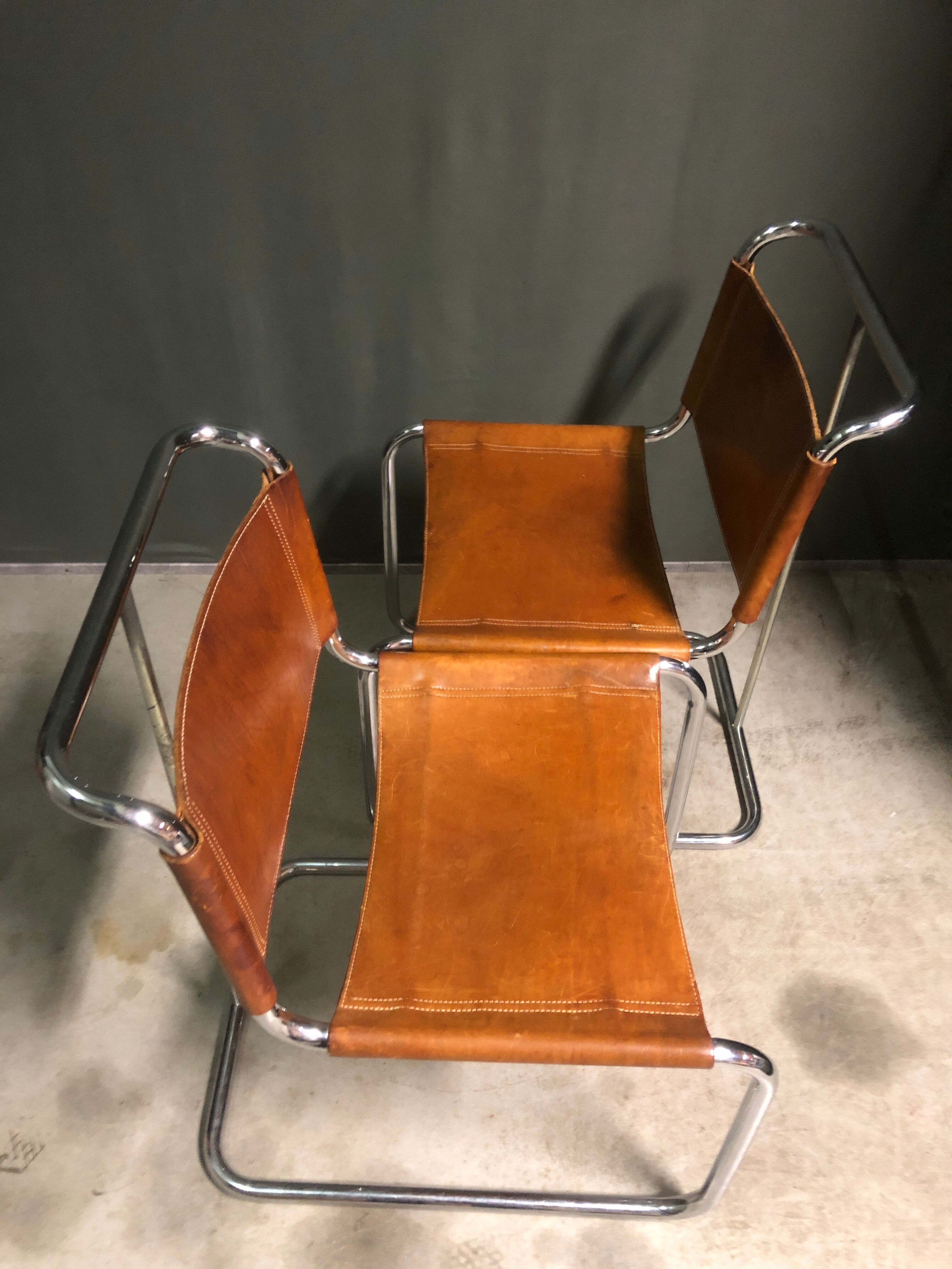 A pair of chromed tubular dining chairs 1980's