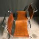 A pair of chromed tubular dining chairs 1980's