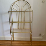 Gilded metal grid shelf in the shape of a vaulted arch