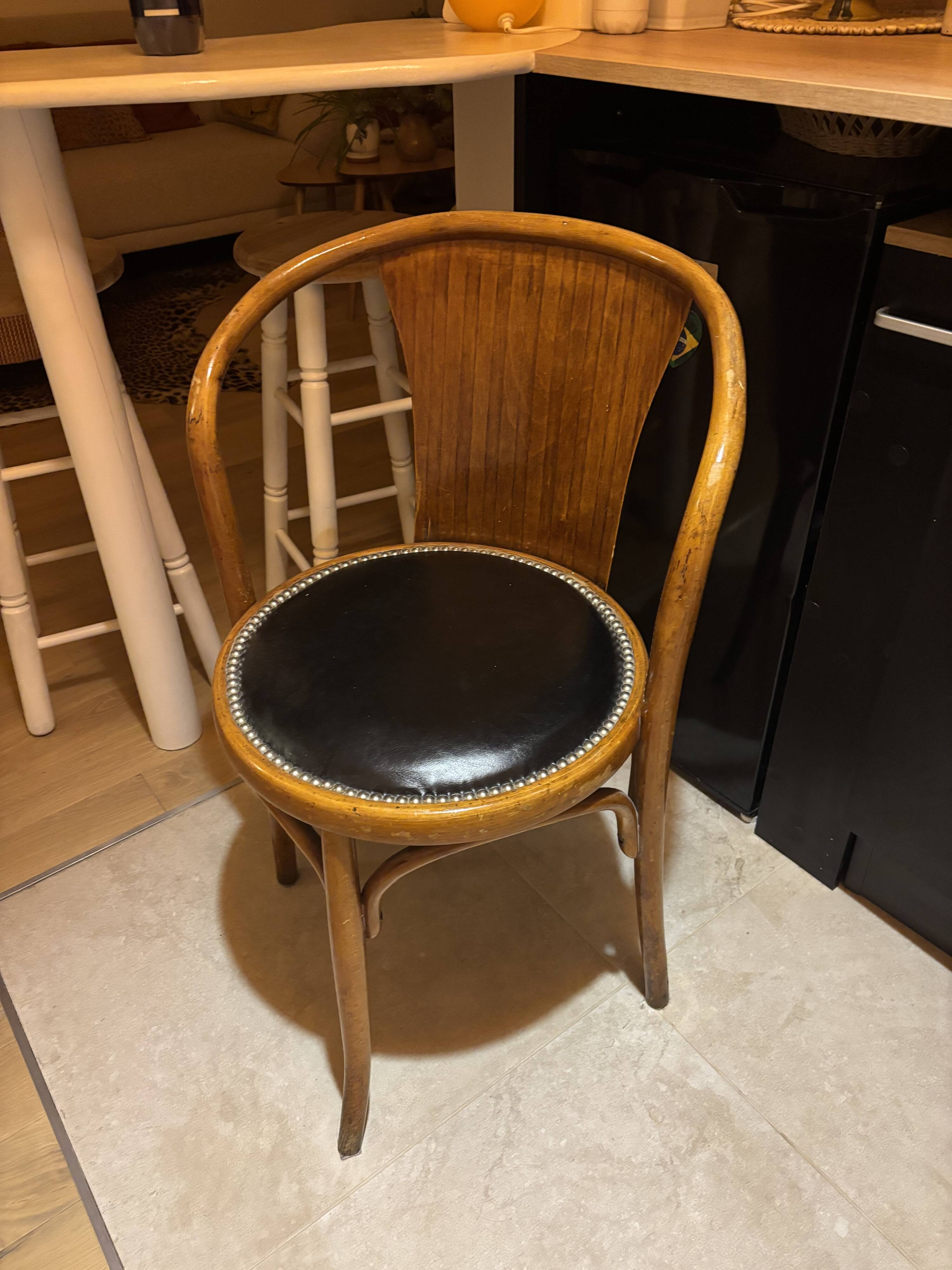 Wooden chair with black leather seat