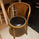 Wooden chair with black leather seat