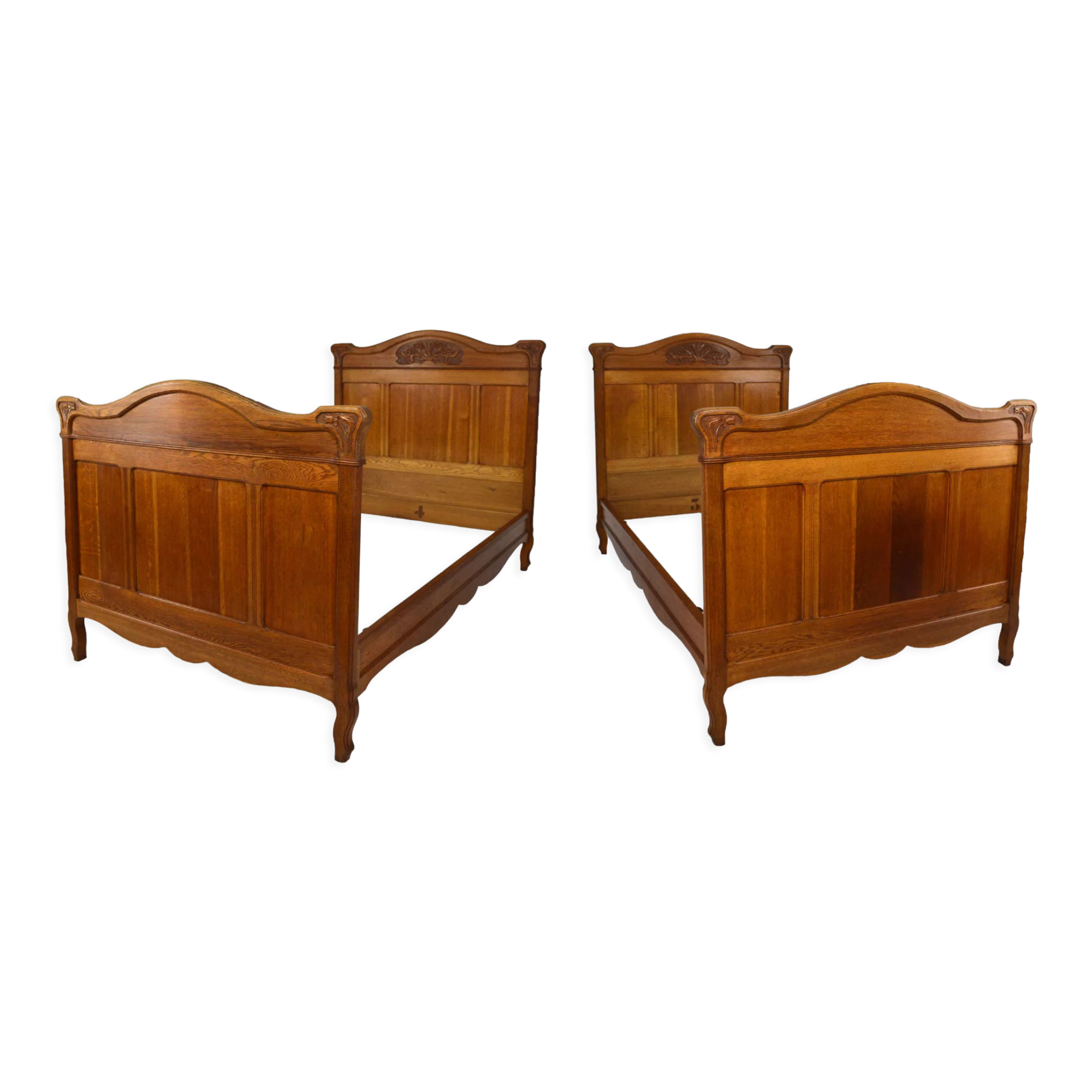 Art Nouveau twin beds in carved solid oak, France, circa 1910
