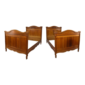 Art Nouveau twin beds in carved solid oak, France, circa 1910