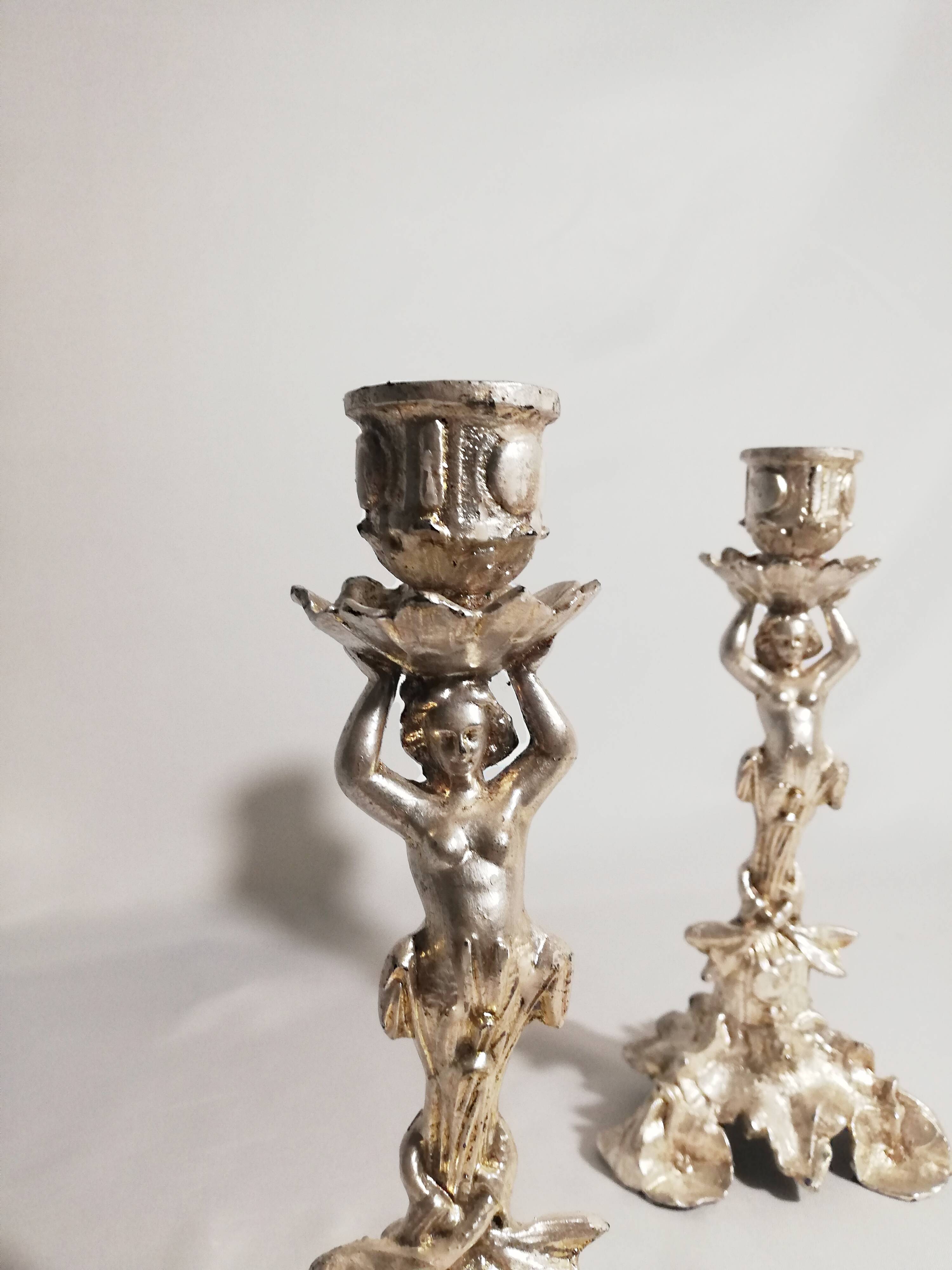 Pair of candlesticks restored to silver leaf