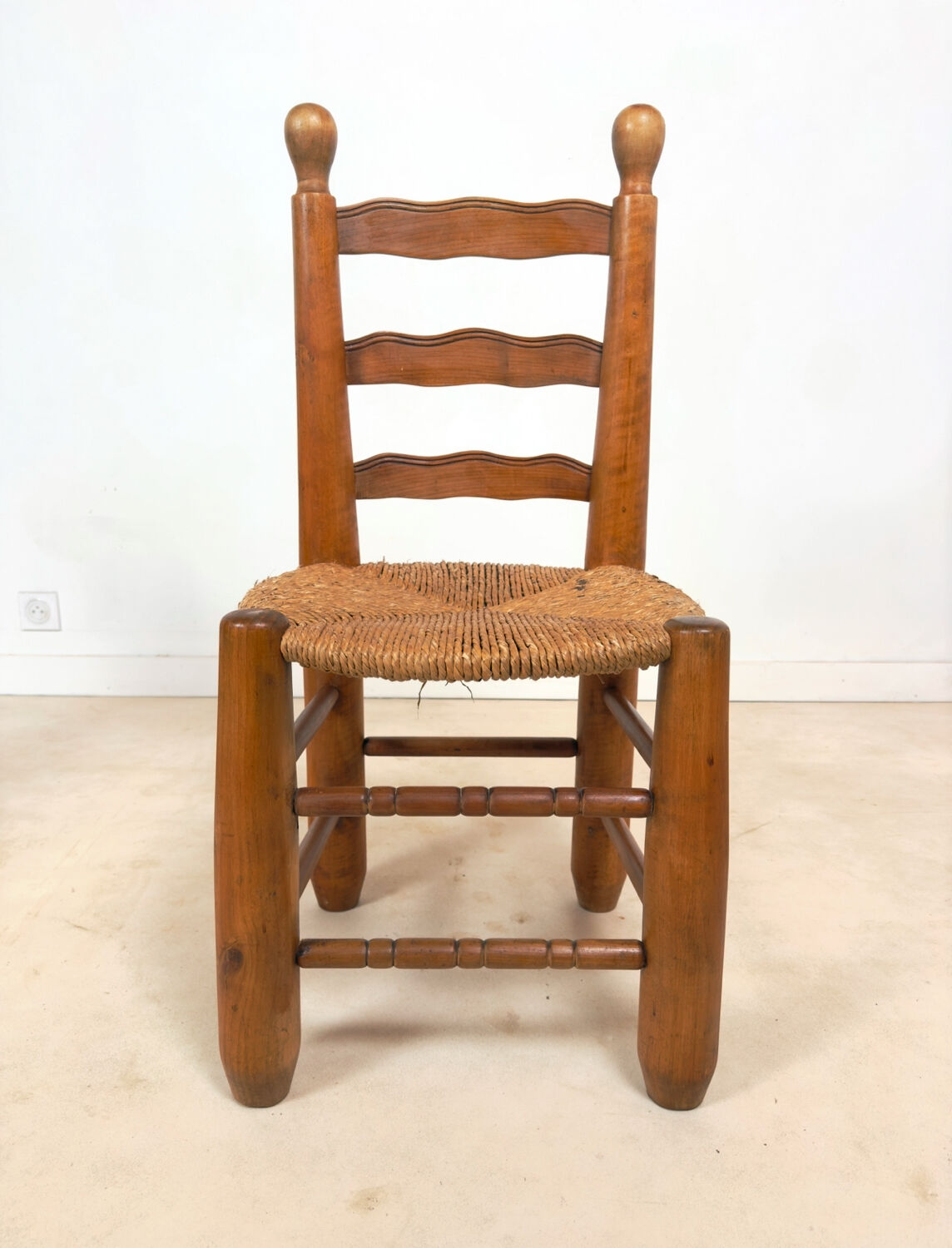 Vintage wooden chair with rush seating