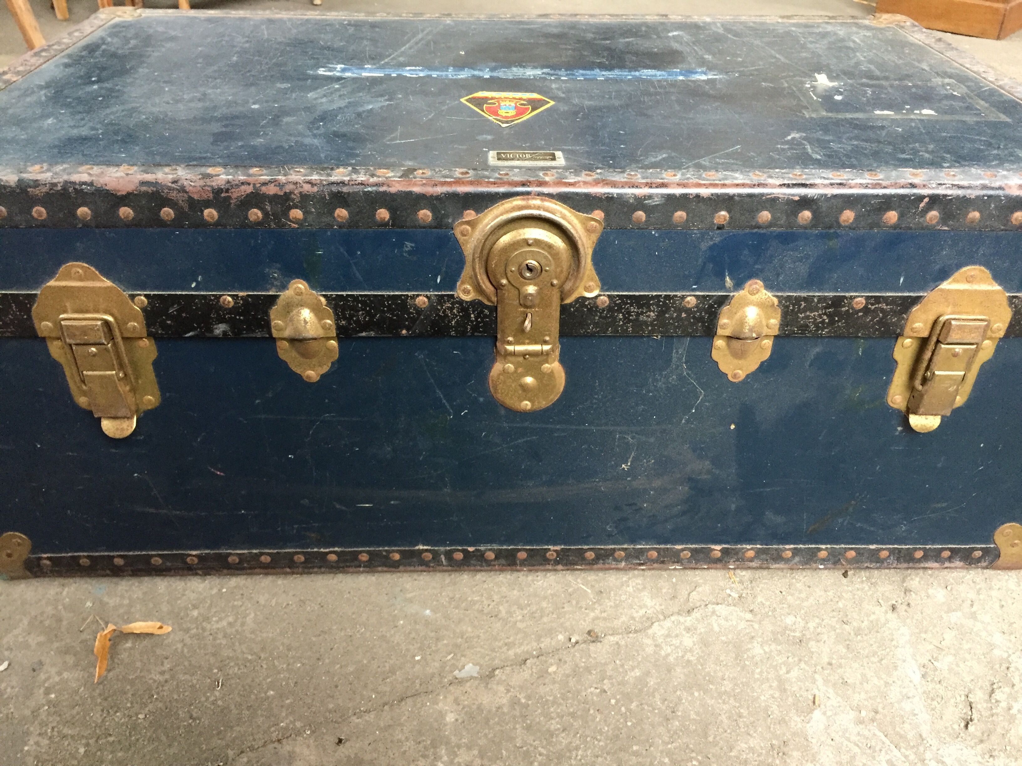 Large blue travel trunk