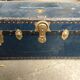 Large blue travel trunk