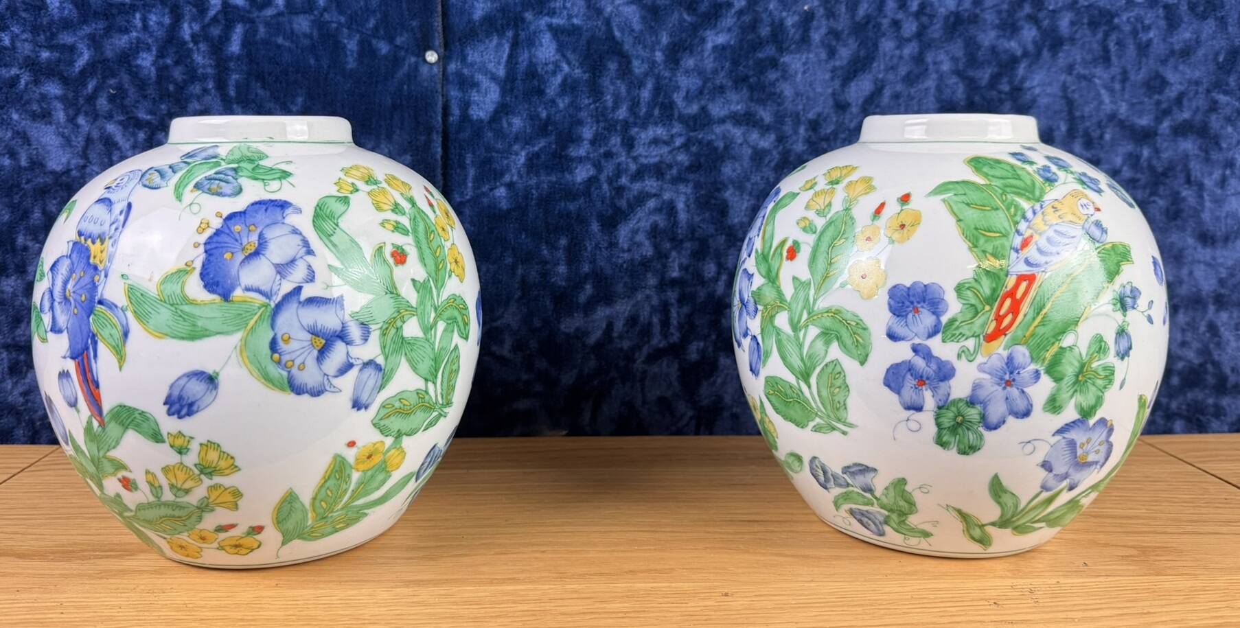 China circa 1900: pair of porcelain ball vases with birds and flowers