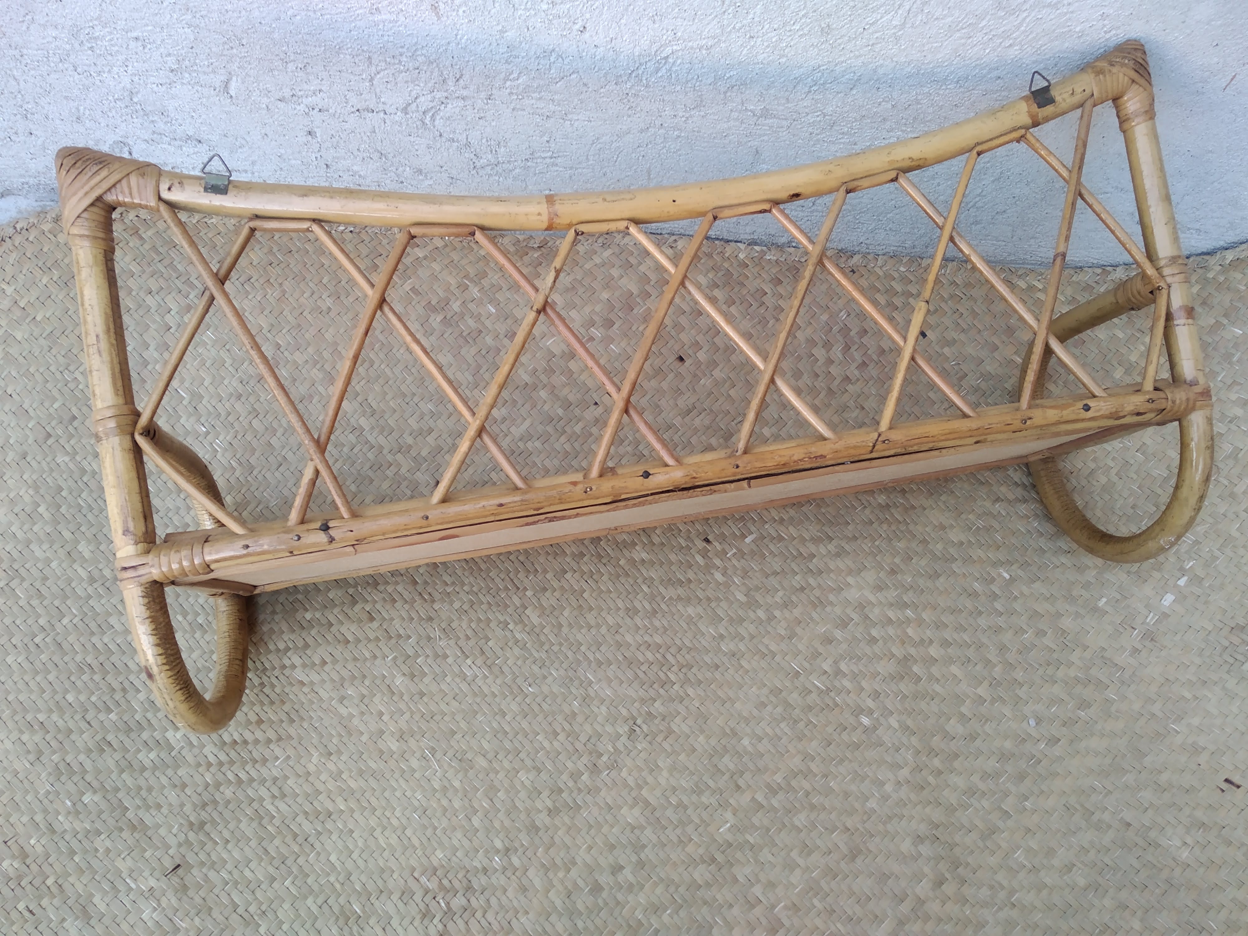Rattan wall shelf from the 60s