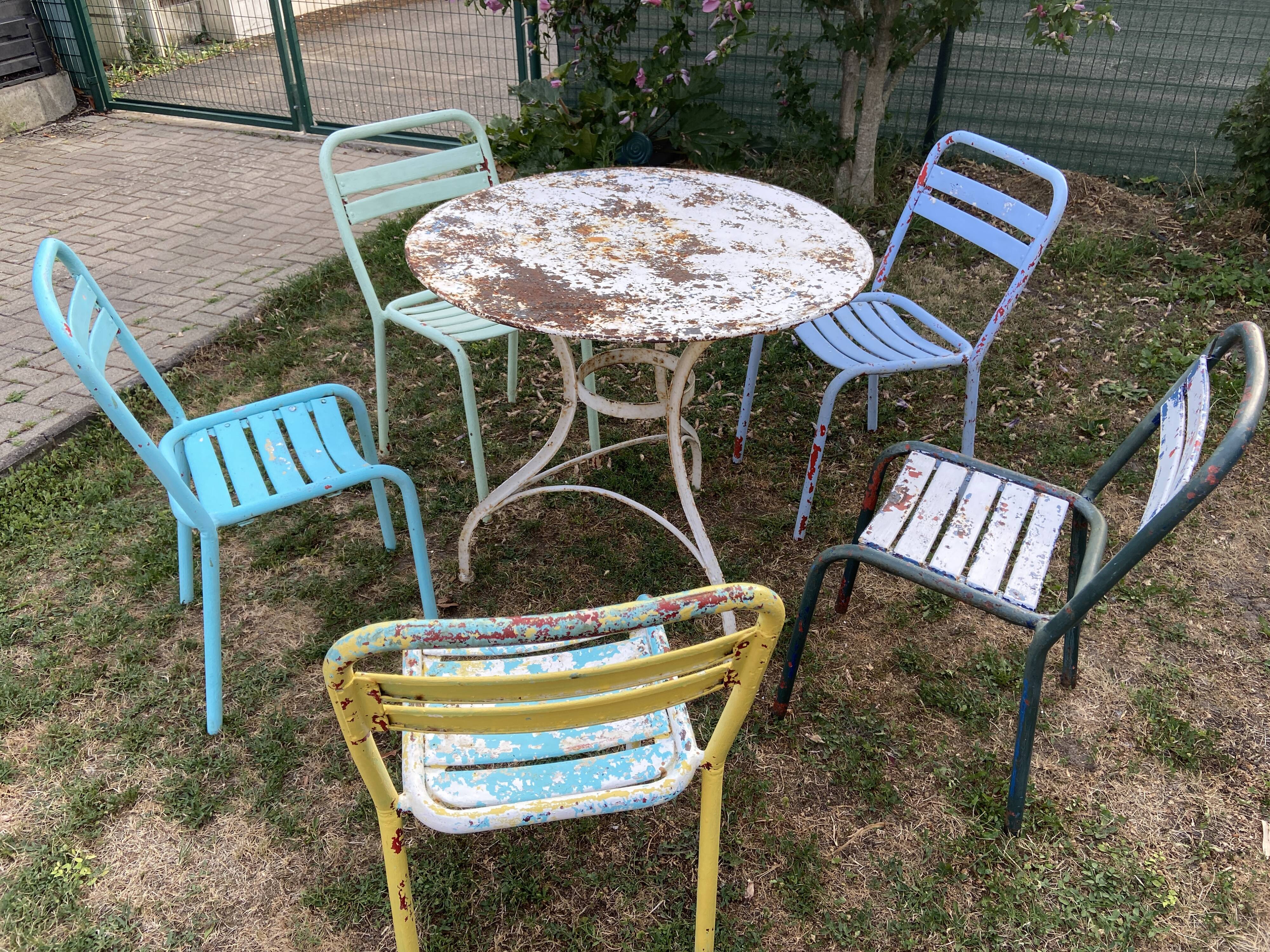 4 mismatched chairs Tolix brasserie bistro terrace French bistro 60s