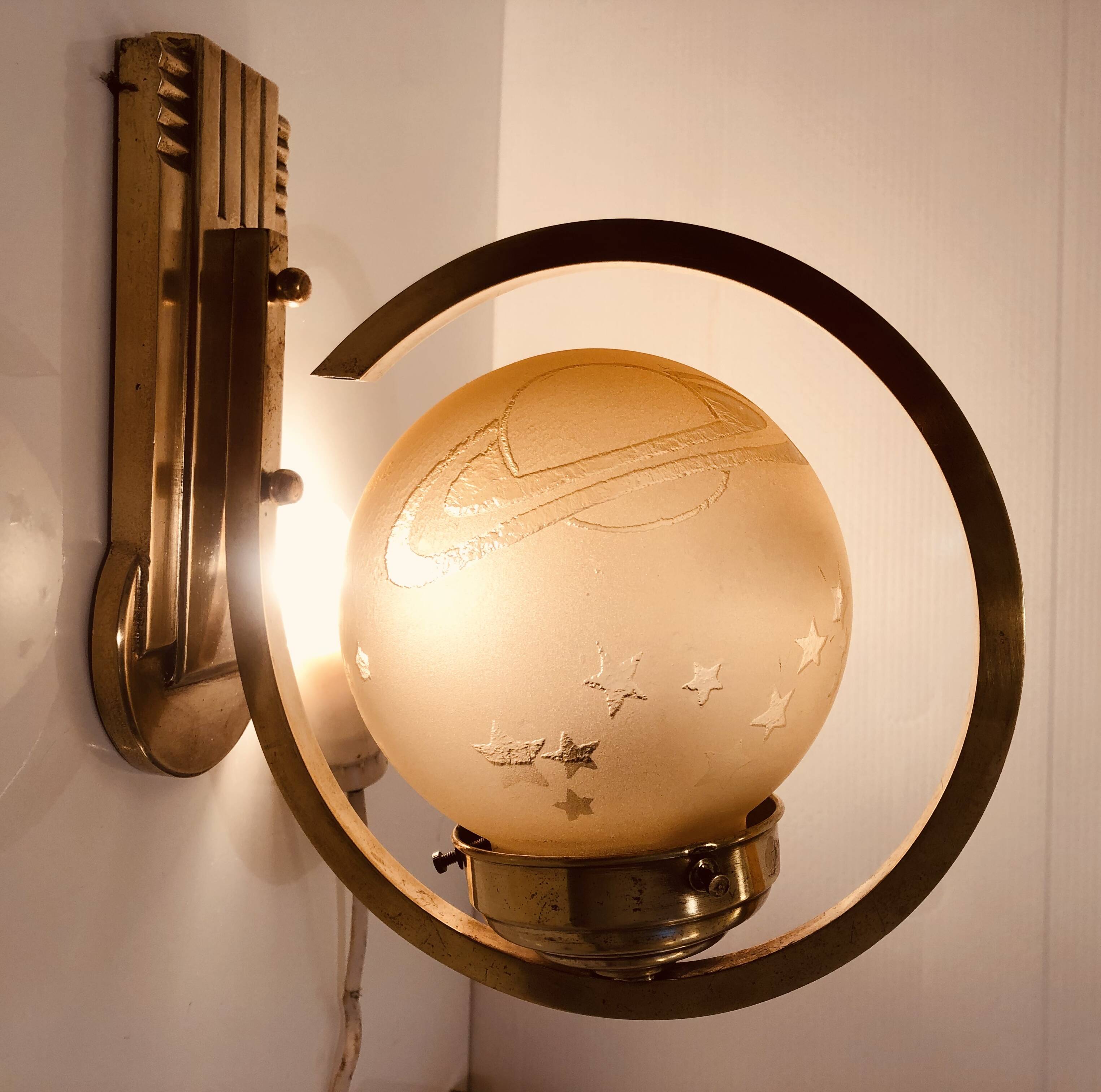 Art Deco wall light 1930-40 signed Deveau brass and glass engraved with stars and planets motif