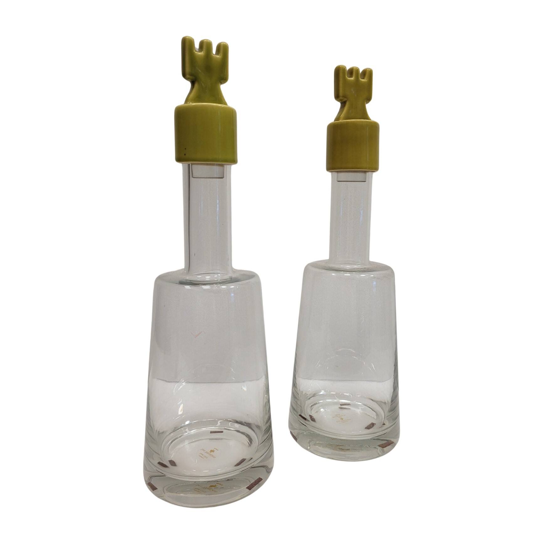 pair of decanters, bottles or jars, made in crystal with a ceramic tap enameled in green color